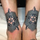two black and grey Tudor roses on legs
